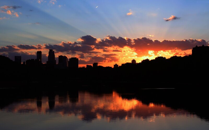 City Skyline at Sunset — Orange, Dramatic, Photograph, Sky, Clouds, Water, Buildings