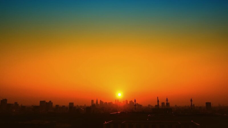 City Skyline at Sunset — Orange, Dramatic, Photograph, Sun, Skyscraper