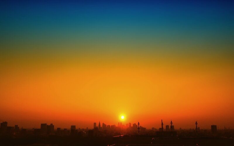 City Skyline at Sunset — Orange, Dramatic, Photograph, Sun, Skyscrapers, Haze