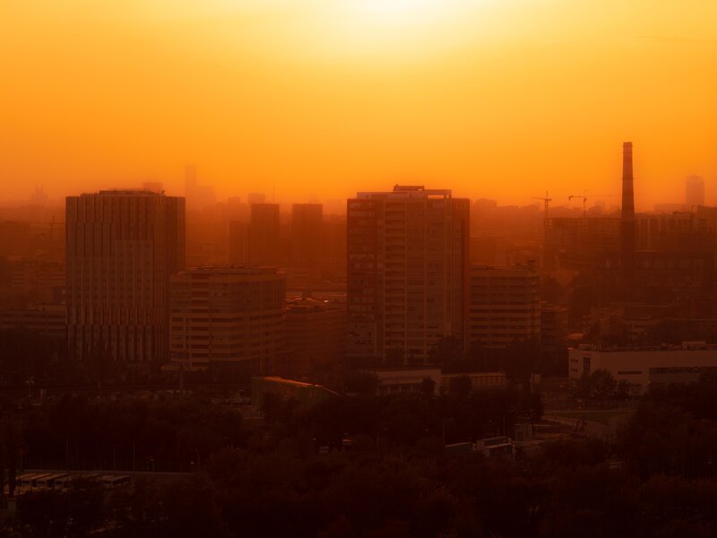 City Skyline at Sunset — Orange, Hazy