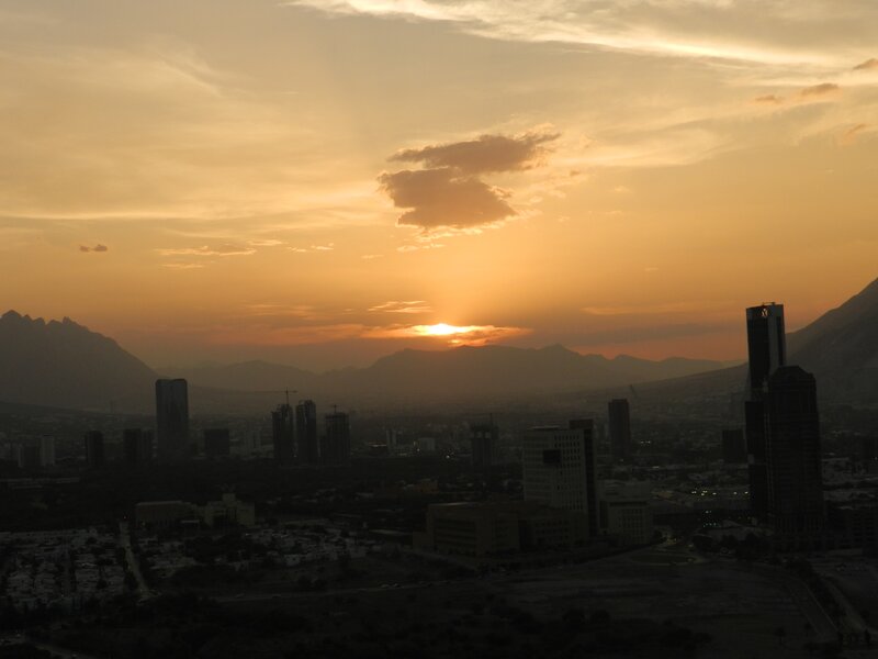 City Skyline at Sunset — Orange, Serene, Photograph, Mountains
