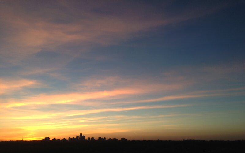 City Skyline at Sunset — Orange, Serene, Photograph, Sky, Clouds, Buildings, Blue