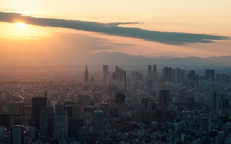 City Skyline at Sunset — Orange, Serene, Photograph, Skyscrapers, Mountains, Clouds