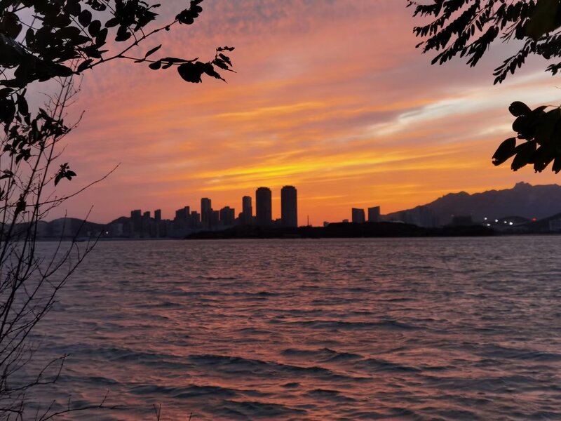 City Skyline at Sunset — Orange, Serene, Photograph, Water