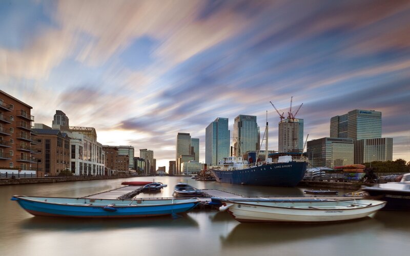 City skyline at sunset with boats