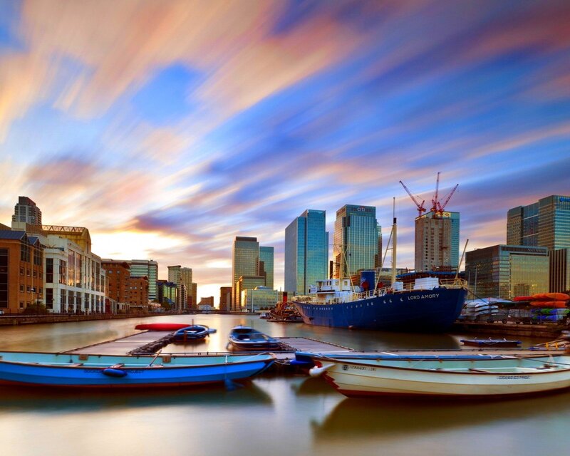 City skyline at sunset with boats
