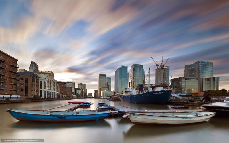 City skyline at sunset with boats