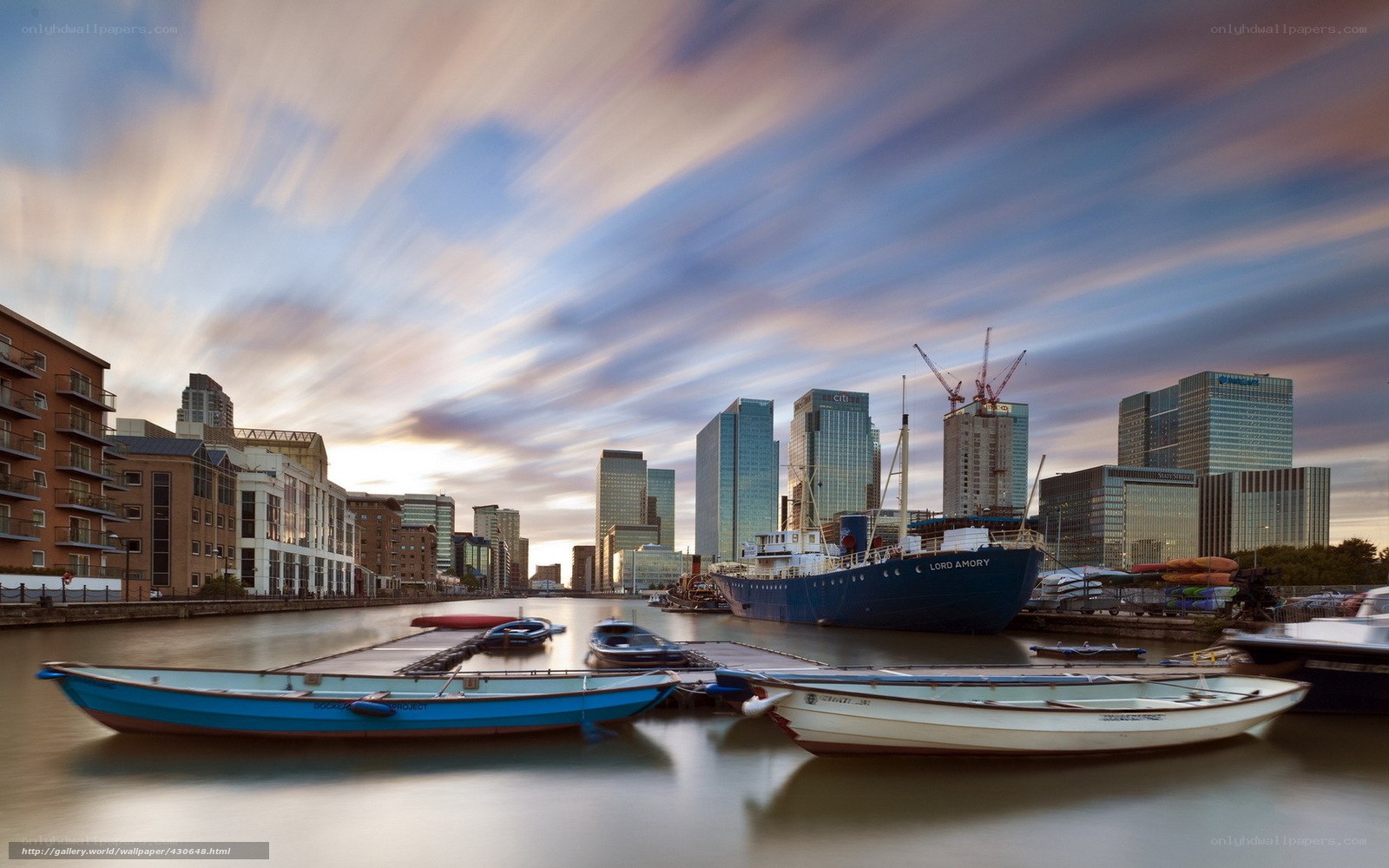City skyline at sunset with boats