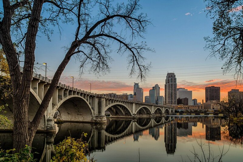 City skyline at sunset with bridge