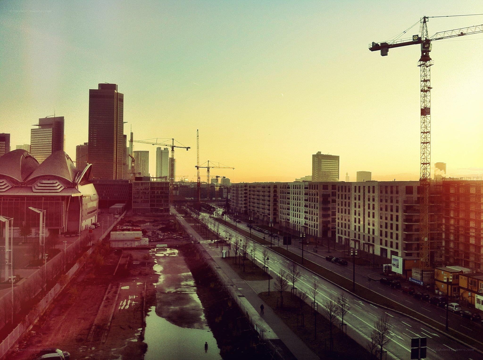 City skyline at sunset with construction