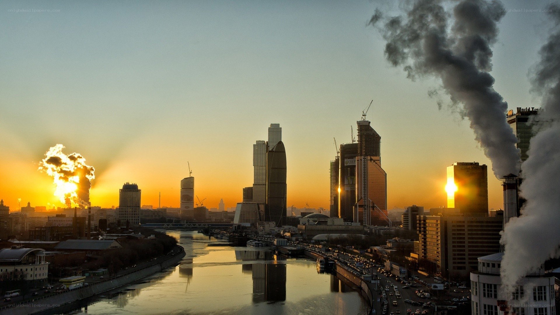 City skyline at sunset with pollution