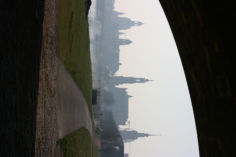city skyline from river path