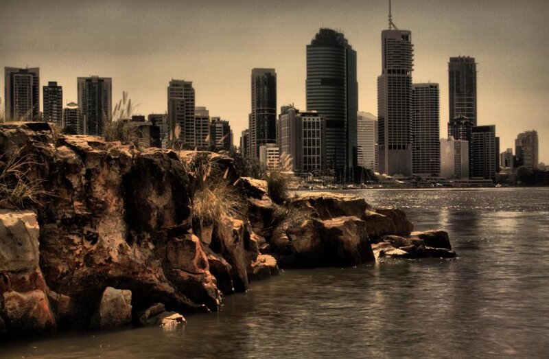 City skyline from rocky shore