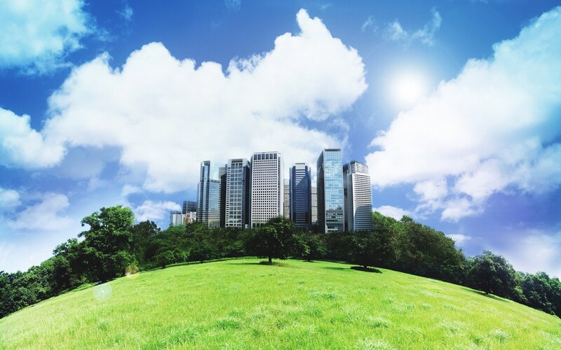 City skyline on a green hill