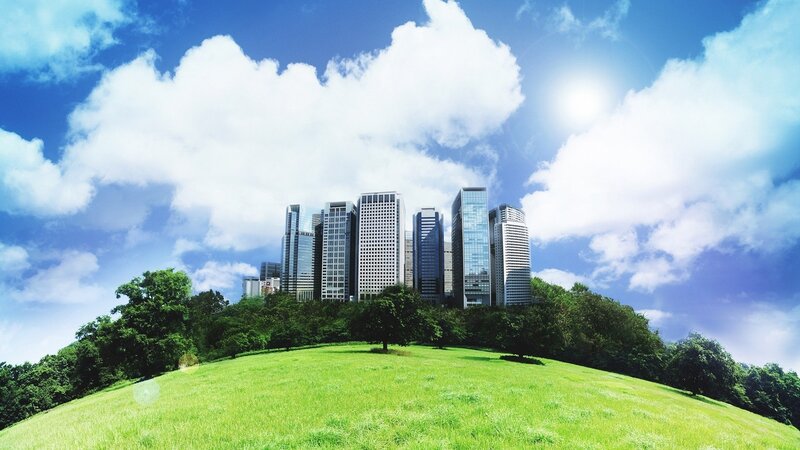 City skyline on a green hill