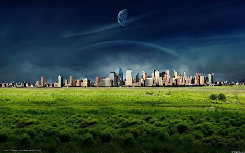 City skyline over green field