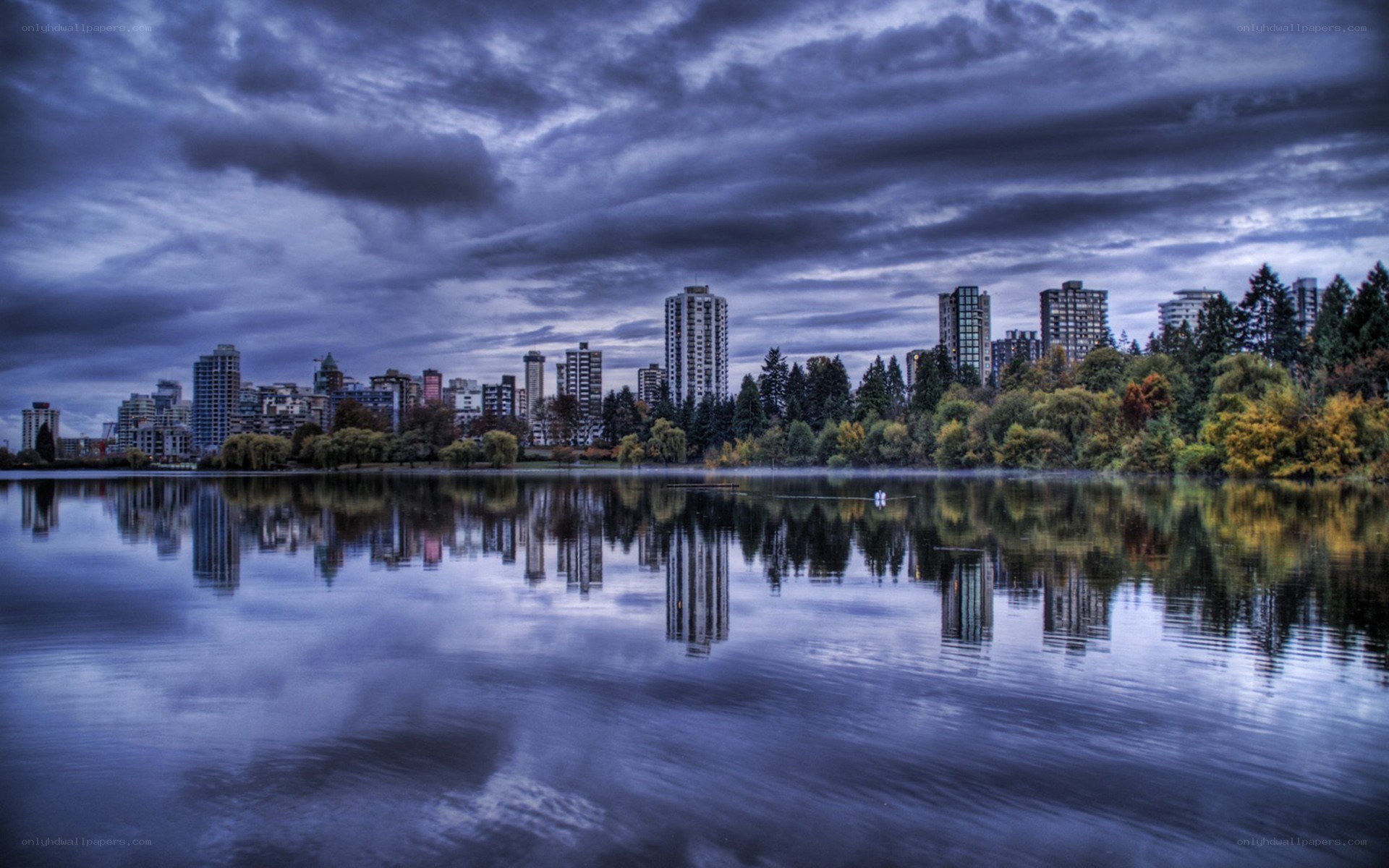 City skyline reflected in a lake