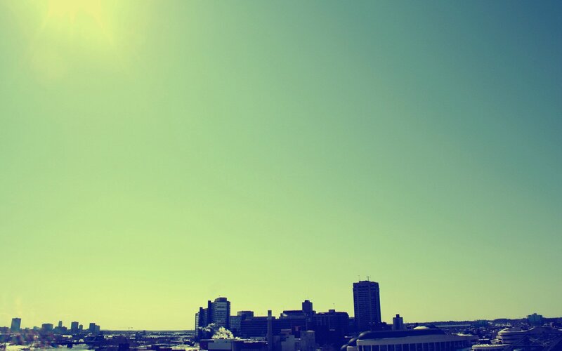 City Skyline under Bright Sky — Green, Afternoon
