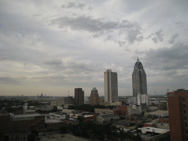 City Skyline under Cloudy Sky — Gray