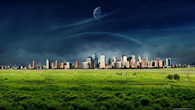 City skyline under moonlit sky