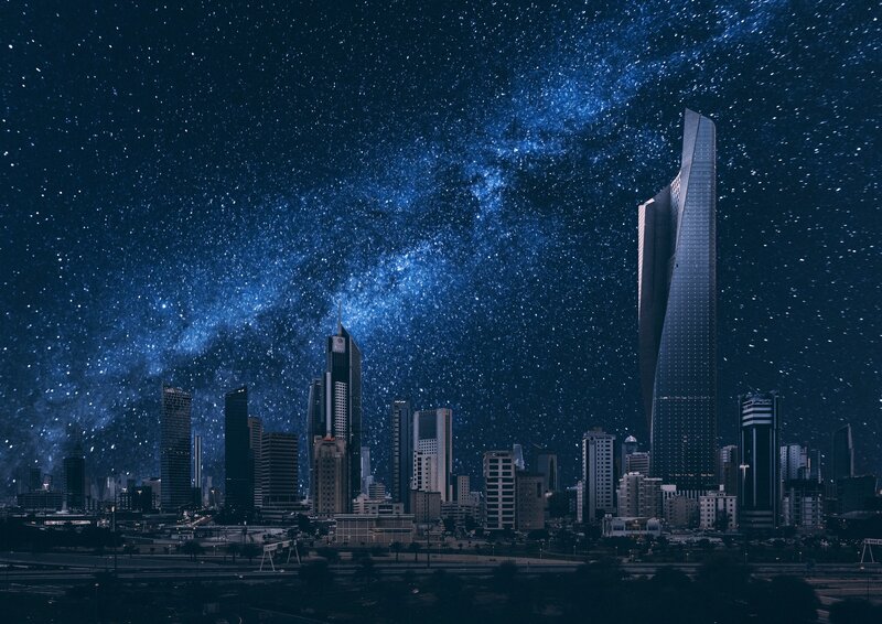 City skyline under starry sky