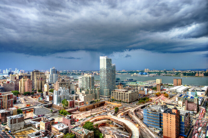 City Skyline under Storm Clouds — Gray, Dramatic, Afternoon, Photograph, Skyscrapers, River, Highway