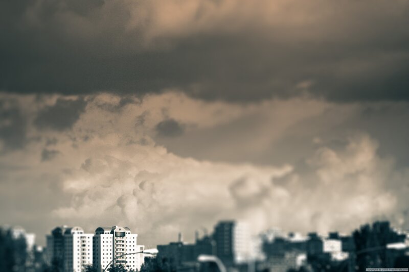 City Skyline under Storm Clouds — Gray, Dramatic, Photograph, Buildings
