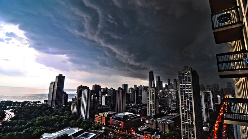 City Skyline under Storm Clouds — Gray, Dramatic, Sunset, Photograph, Skyscrapers, Balcony, Lake