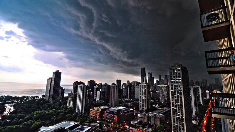 City Skyline under Storm Clouds — Gray, Dramatic, Sunset