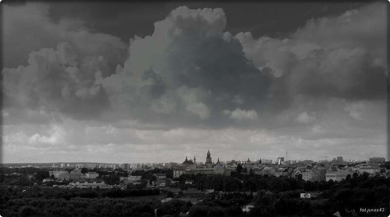 City skyline under stormy clouds