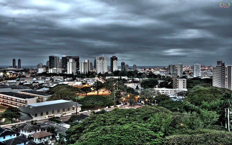 city skyline under stormy sky