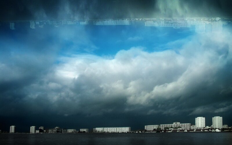City skyline under stormy sky