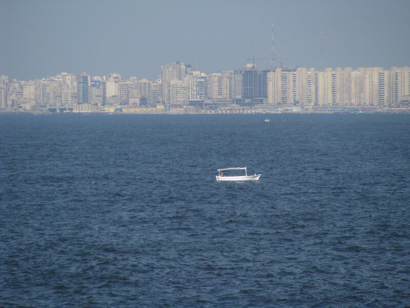 City skyline with boat on water