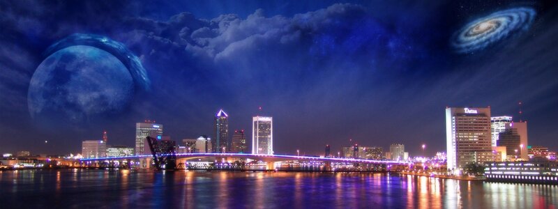 City skyline with celestial bodies
