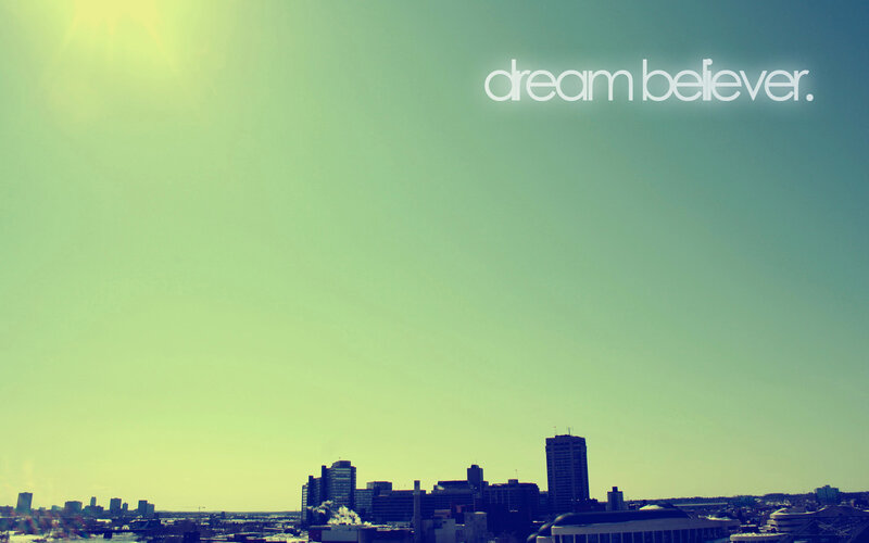 city skyline with dream believer text