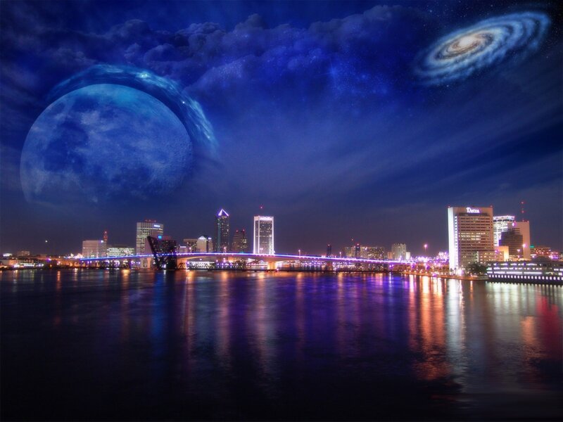 City skyline with giant moon and galaxy