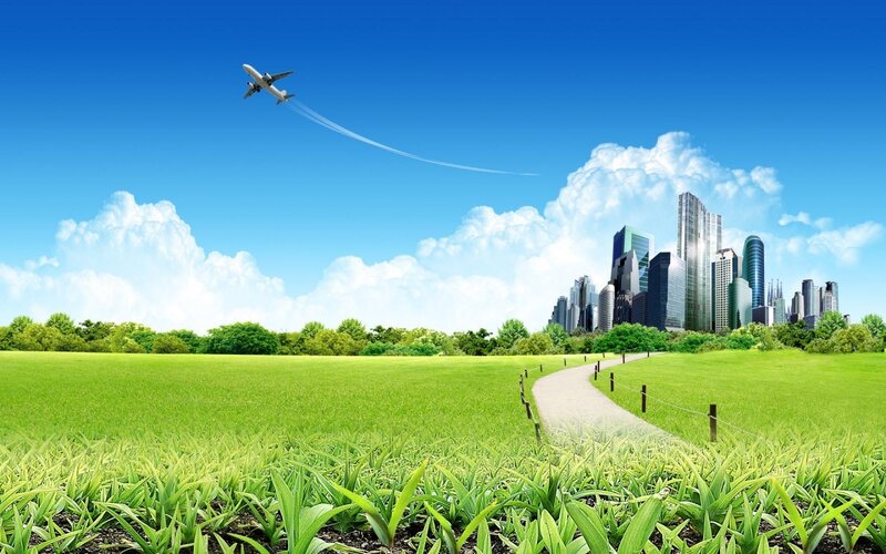 City skyline with green field