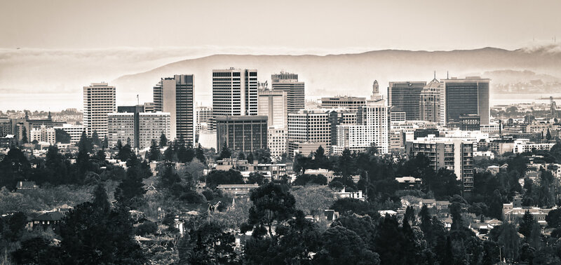 city skyline with hills in background