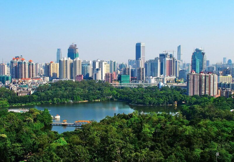 City skyline with lake and park