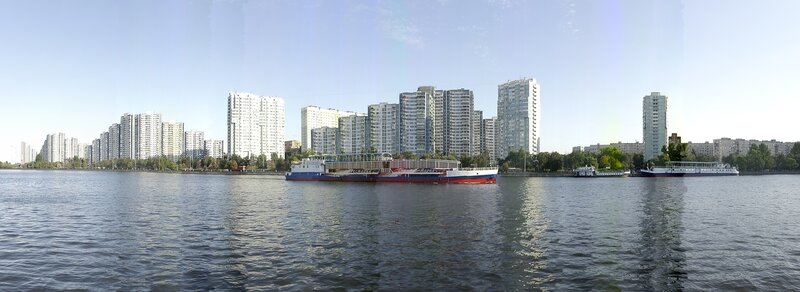 City skyline with river and boats