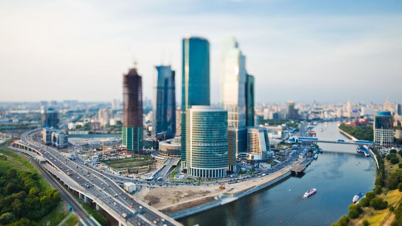 city skyline with river and bridges