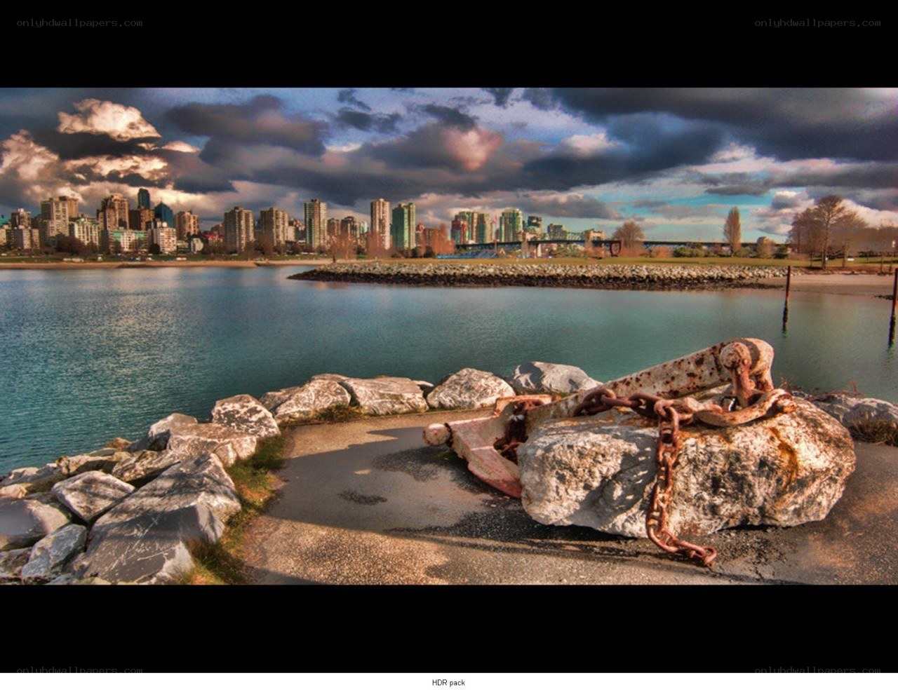 City skyline with rusty anchor