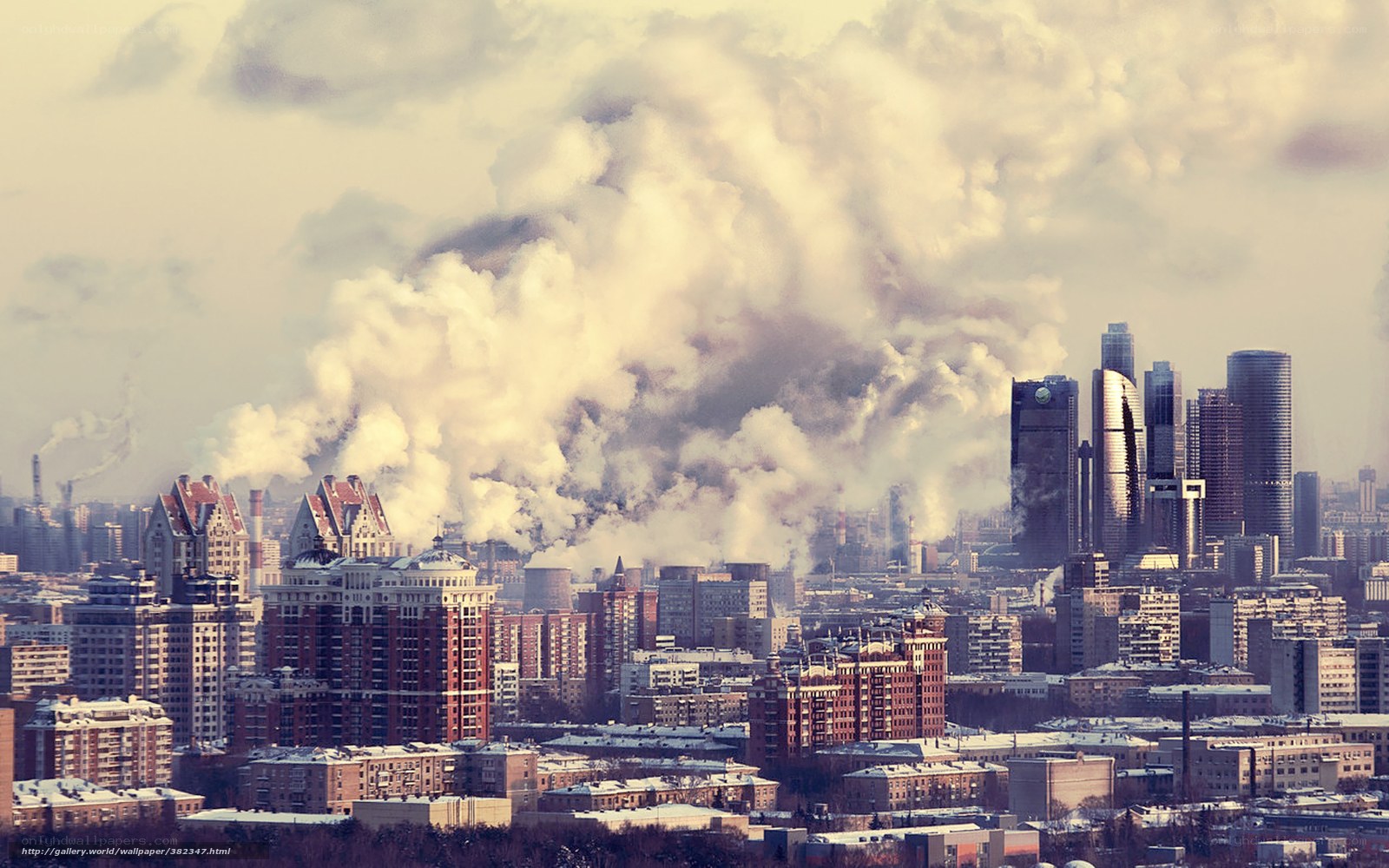 City skyline with smoke plumes