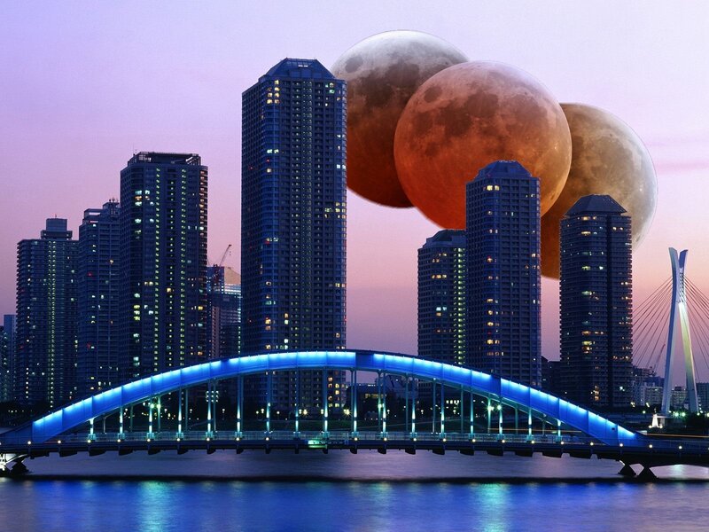 City skyline with three moons