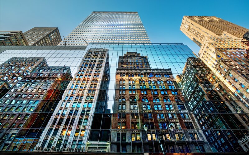 City skyscrapers reflected in glass