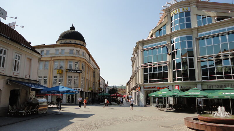City square with fountain and buildings