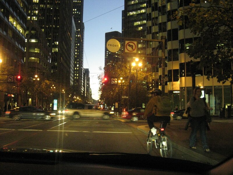 City street at dusk with cyclist
