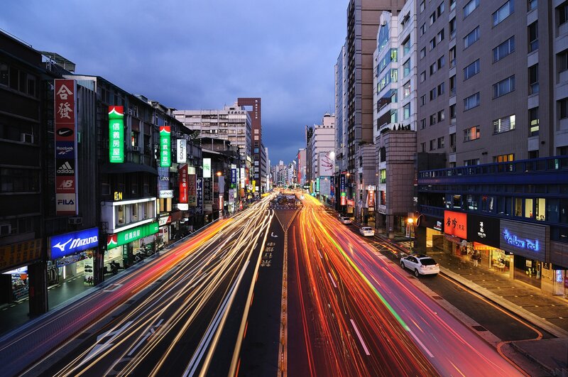 City street at dusk with light trails