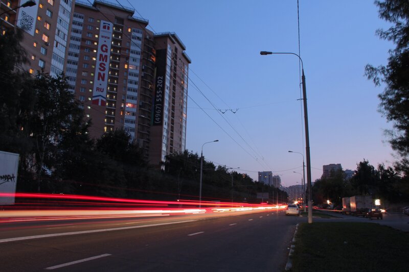 City street at dusk with light trails