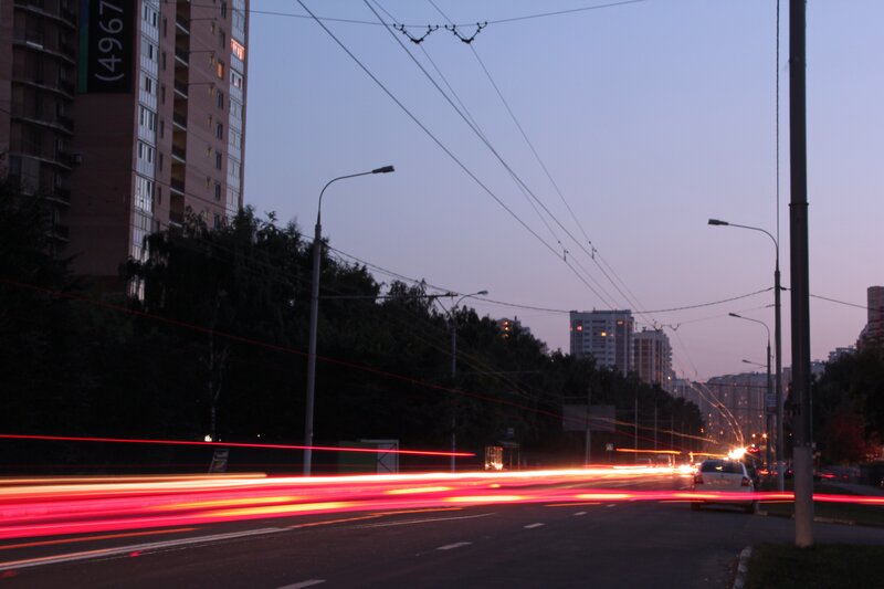 City street at dusk with light trails
